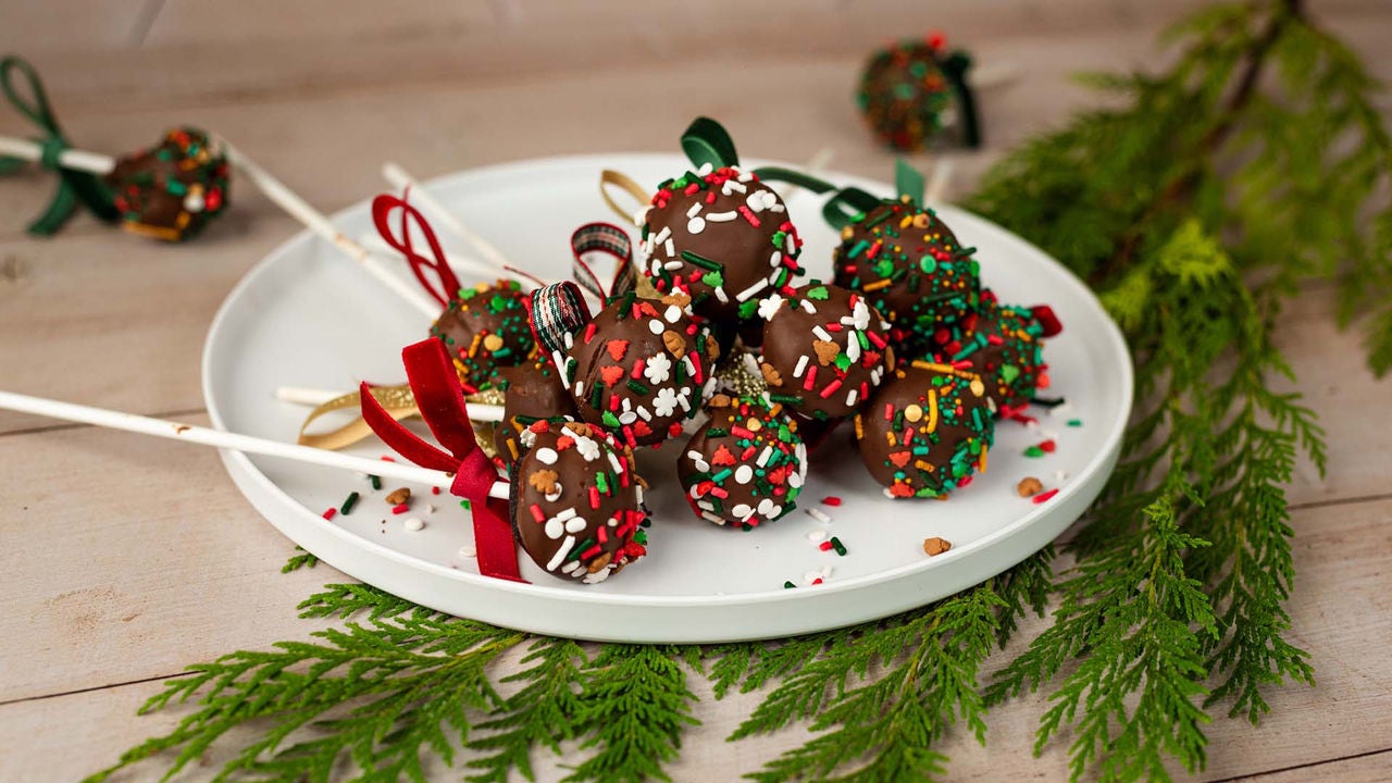 set of christmas brownie pops on a stick with holiday bows