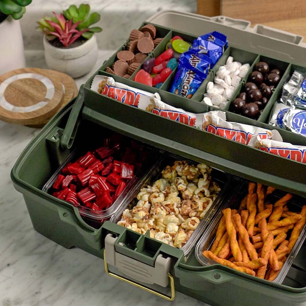 tackle box filled with assorted hersheys candies and salty snacks