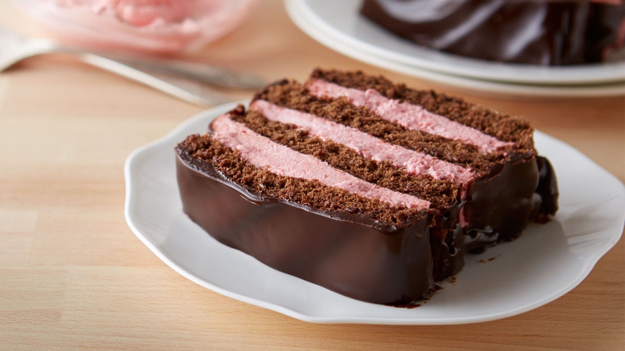 strawberry whipped cream frosting layered with chocolate cakes