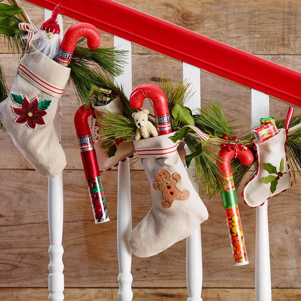 filled stockings hanging from banister