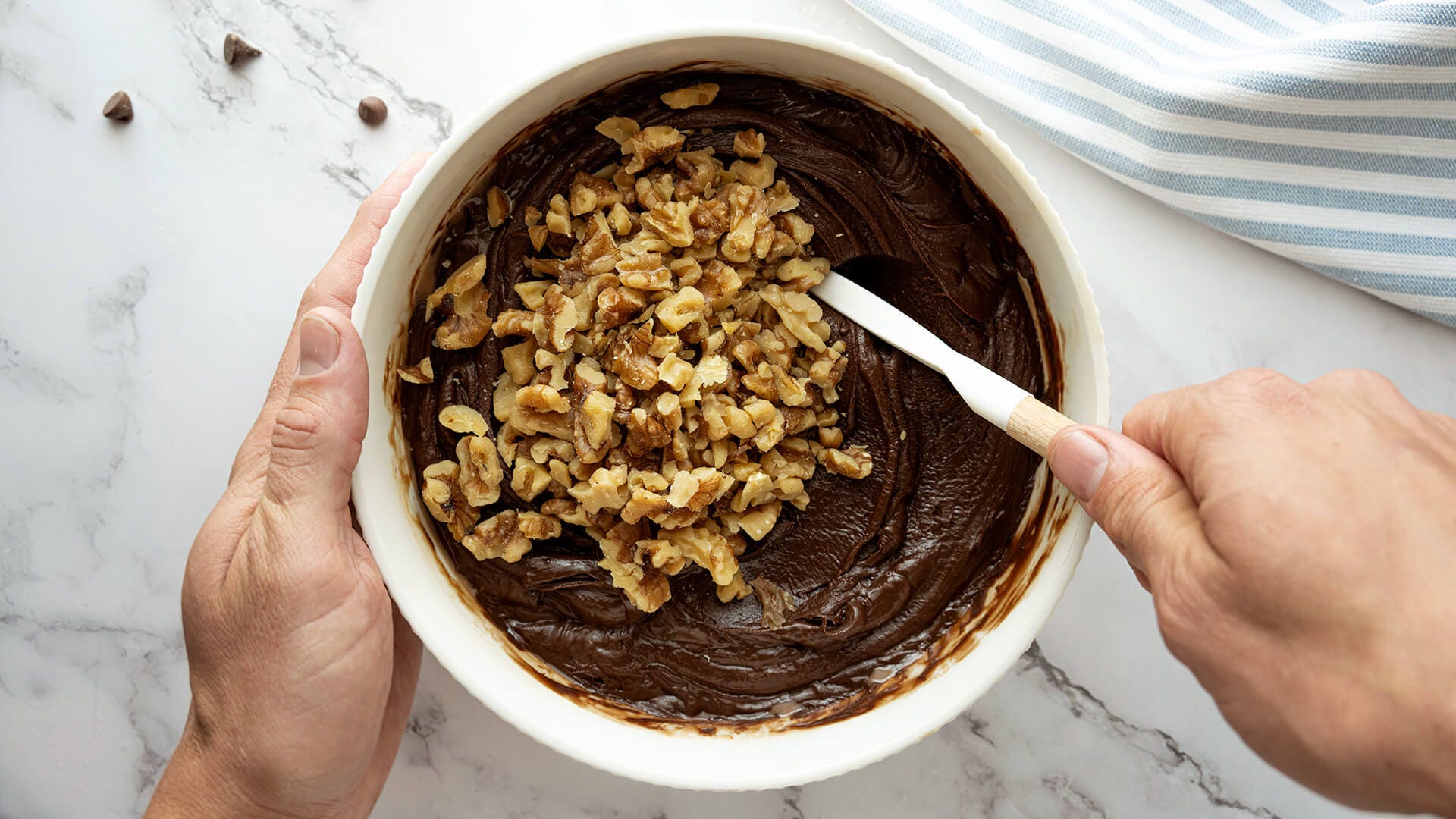 chopped nuts mixed into chocolate mixture