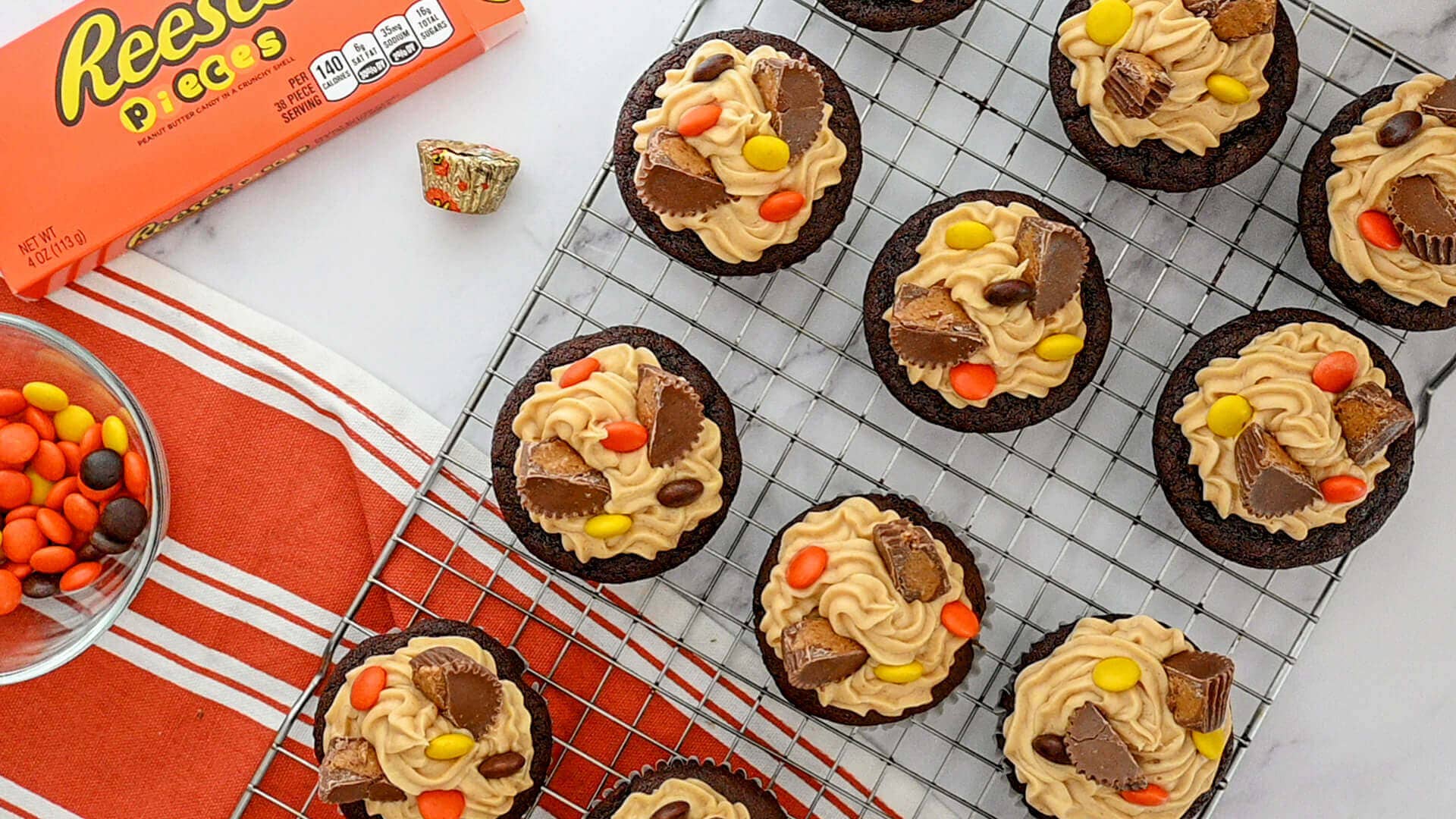 decorated cupcakes on cooling rack