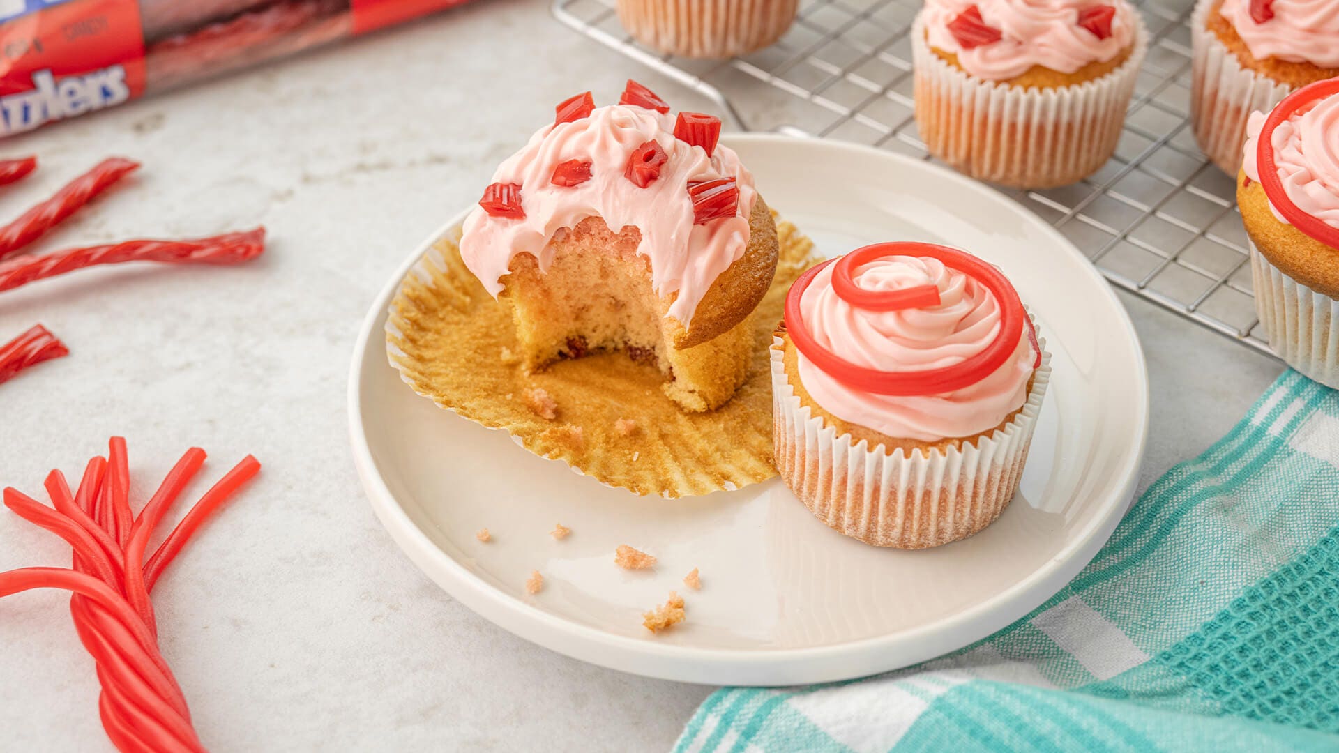 twizzlers strawberry cupcake with a bit etakn out of it