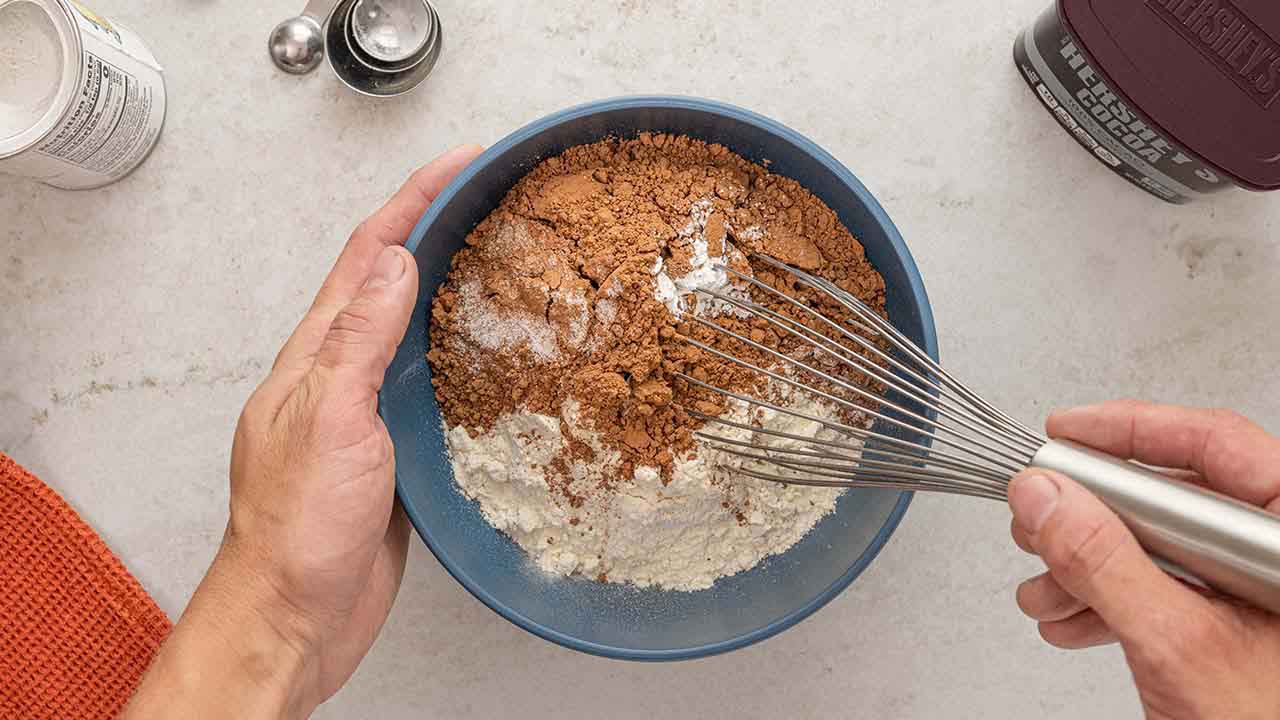 mixing flour, cocoa, baking powder, and salt together in a bowl