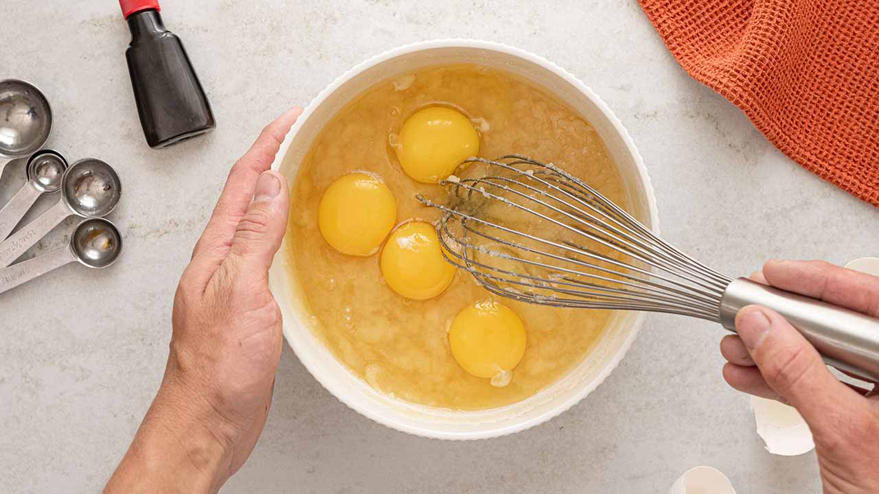 mixing butter, sugar, vanilla, and eggs together in a bowl