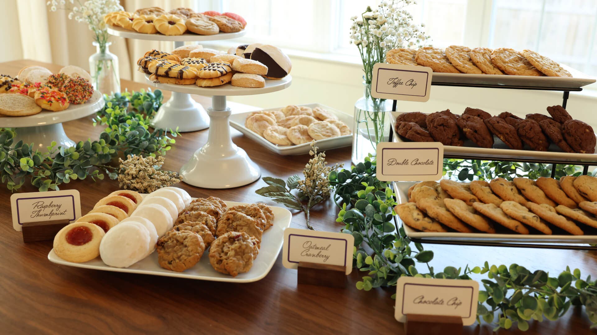 dessert tables with trays of cookiea