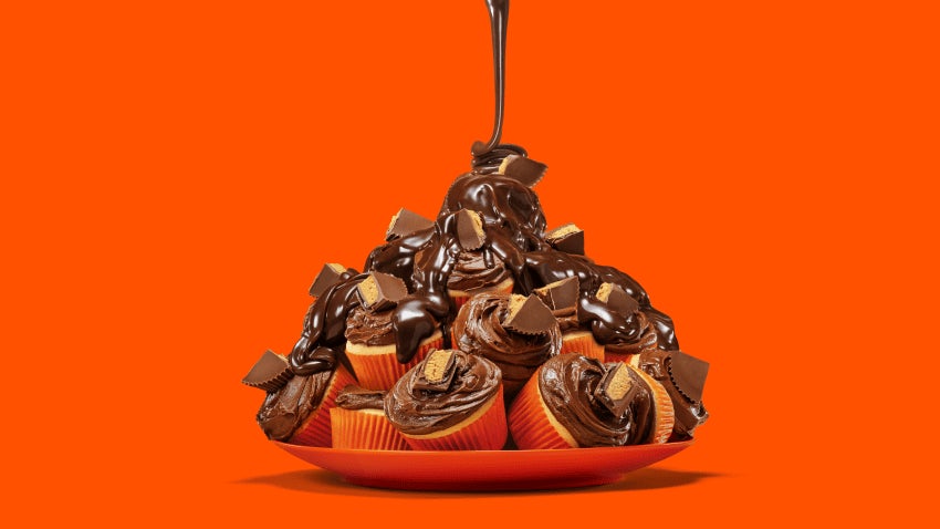 plate of piled reeses chocolate lava cupcakes