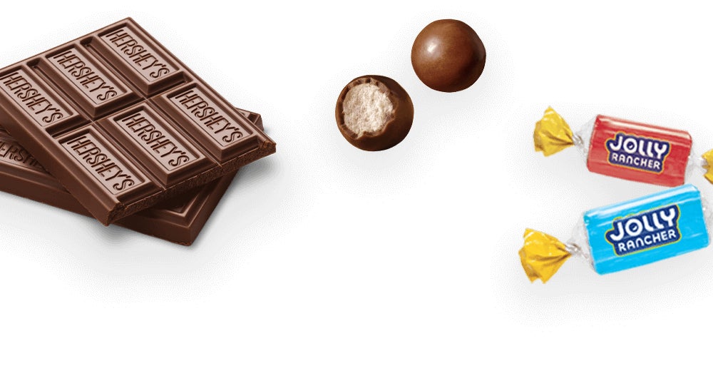 assorted wrapped and unwrapped hersheys candies